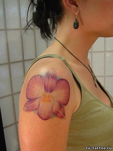Фото и значение татуировки Орхидея.  51683682